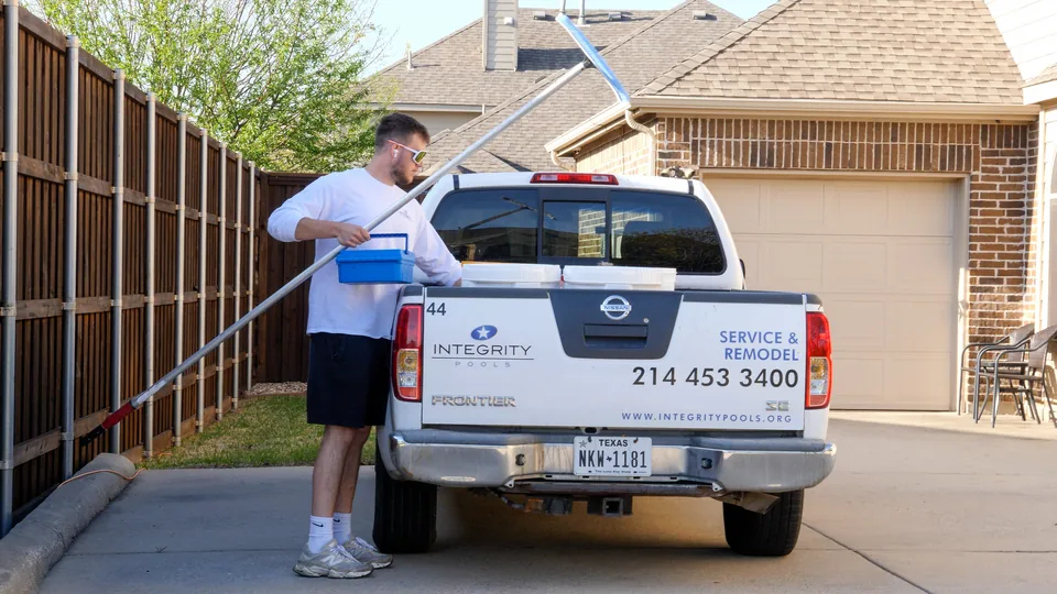 Integrity Pools service truck at a customer's home